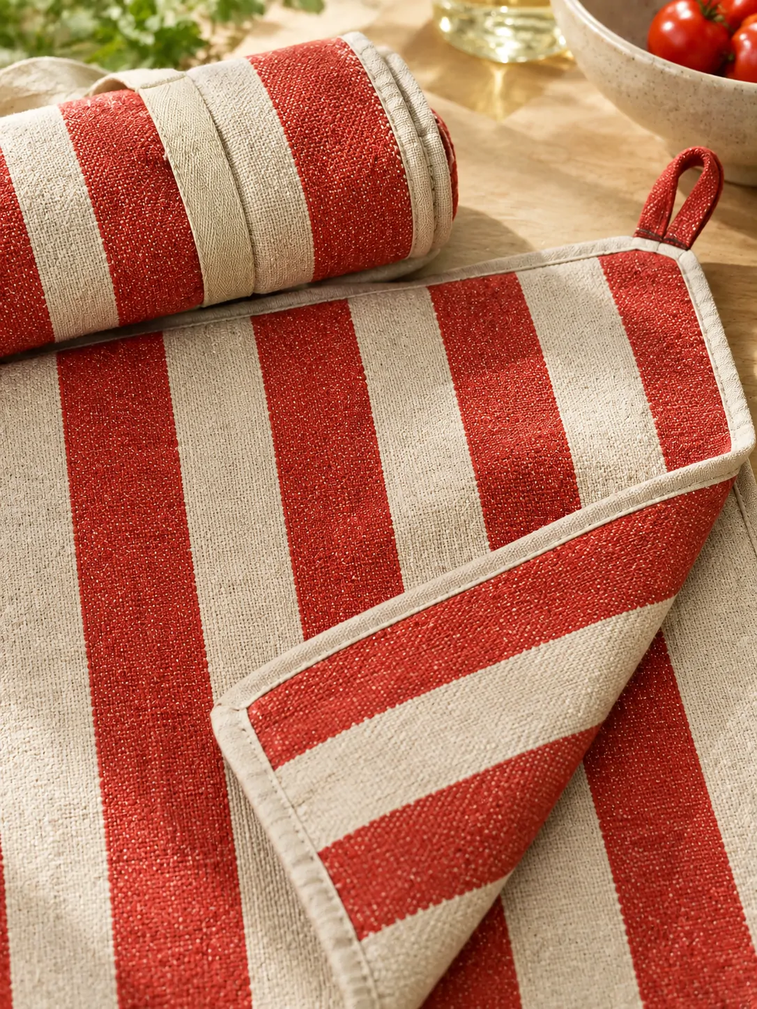 Roll-Up Picnic Blanket with Straps close up: edge finish and red corner loop