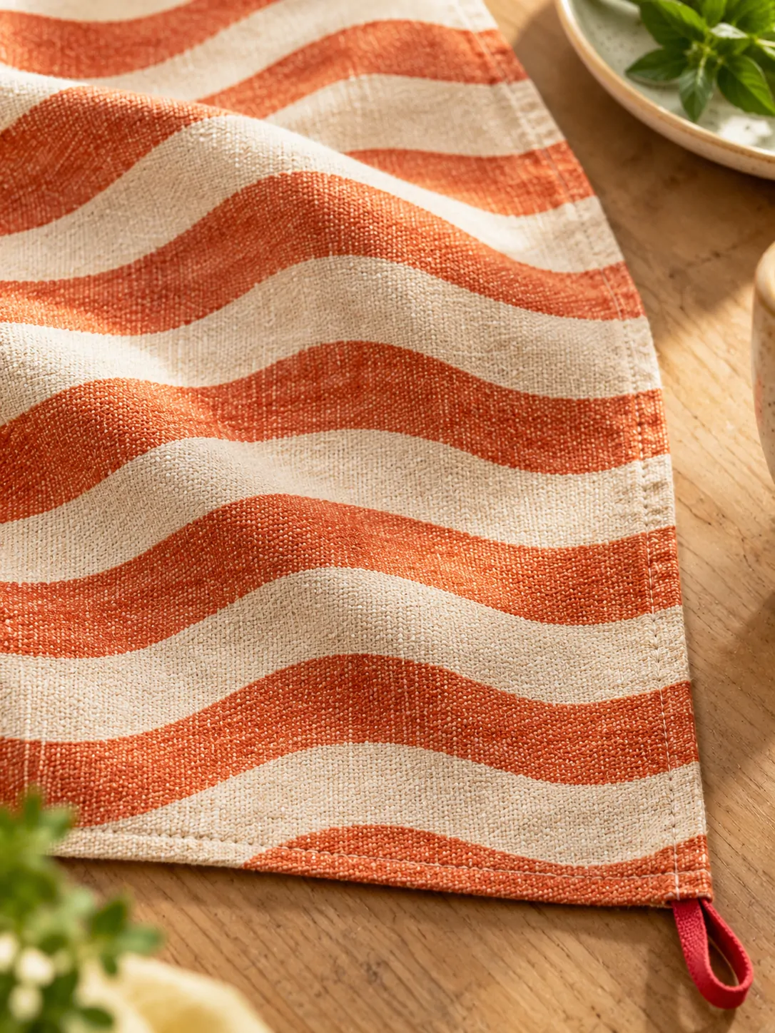 Wave Line Table Runner close up: edge finish and red corner loop